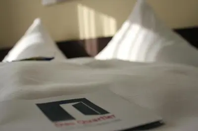 Ein Bett oder Betten in einem Zimmer der Unterkunft Das Quartier