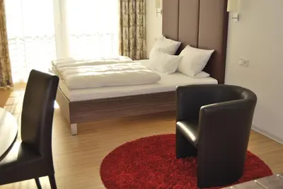 Ein Bett oder Betten in einem Zimmer der Unterkunft Das Quartier