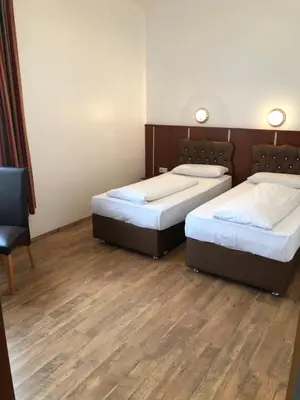 Ein Bett oder Betten in einem Zimmer der Unterkunft Hotel Verdi