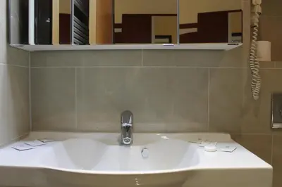 Ein Badezimmer in der Unterkunft Hotel Verdi