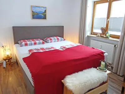Ein Bett oder Betten in einem Zimmer der Unterkunft Ferienwohnung Murmeltier