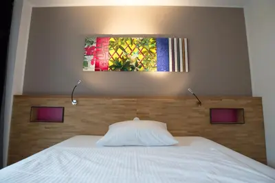 Ein Bett oder Betten in einem Zimmer der Unterkunft fab Hotel