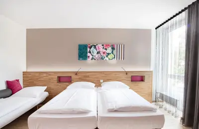Ein Bett oder Betten in einem Zimmer der Unterkunft fab Hotel