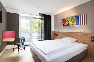 Ein Bett oder Betten in einem Zimmer der Unterkunft fab Hotel