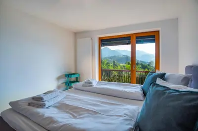 Ein Bett oder Betten in einem Zimmer der Unterkunft Künstlervilla mit grandiosem Panoramablick