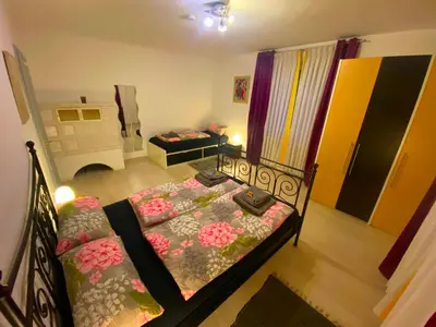 Ein Bett oder Betten in einem Zimmer der Unterkunft Ferienwohnung Zusmarshausen