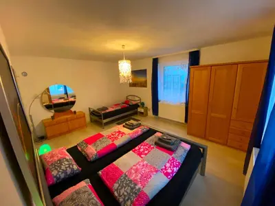 Ein Bett oder Betten in einem Zimmer der Unterkunft Ferienwohnung Zusmarshausen