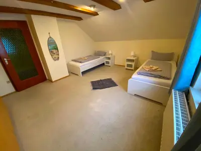 Ein Bett oder Betten in einem Zimmer der Unterkunft Ferienwohnung Zusmarshausen