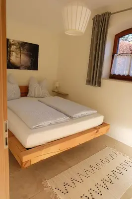 Ein Bett oder Betten in einem Zimmer der Unterkunft Ferienwohnung Stöckl