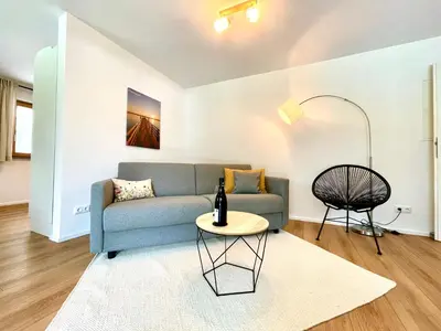Ein Sitzbereich in der Unterkunft Sweet Home Apartment Ammersee - eco-friendly, Boxspring, Garden, WiFi