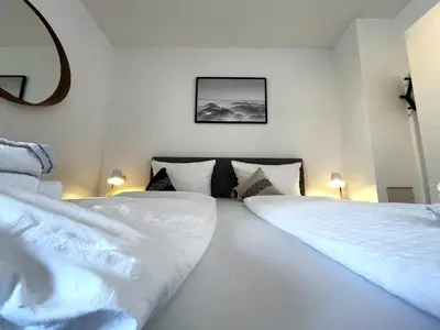 Ein Bett oder Betten in einem Zimmer der Unterkunft Seeuferresidenz am Adrian Stoop NEU eingerichtet