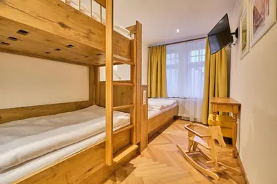 Ein Bett oder Betten in einem Zimmer der Unterkunft Brauereigasthof zum Kuchlbauer