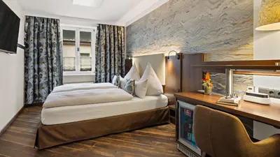 Ein Bett oder Betten in einem Zimmer der Unterkunft Hotel Deutsche Eiche