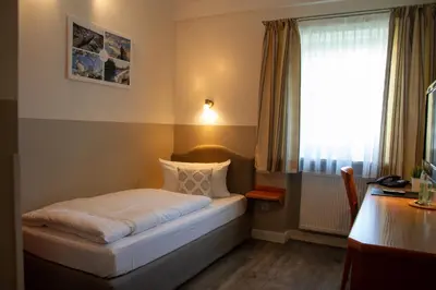 Ein Bett oder Betten in einem Zimmer der Unterkunft Hotel Bastei