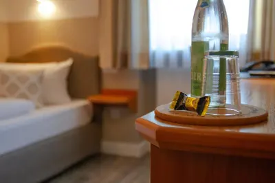 Ein Bett oder Betten in einem Zimmer der Unterkunft Hotel Bastei