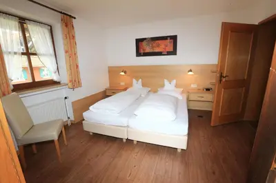 Ein Bett oder Betten in einem Zimmer der Unterkunft La Locanda Ristorante Pizzeria Garni