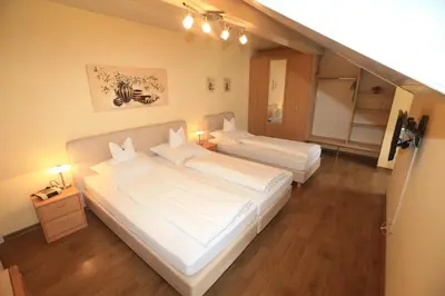 Ein Bett oder Betten in einem Zimmer der Unterkunft La Locanda Ristorante Pizzeria Garni