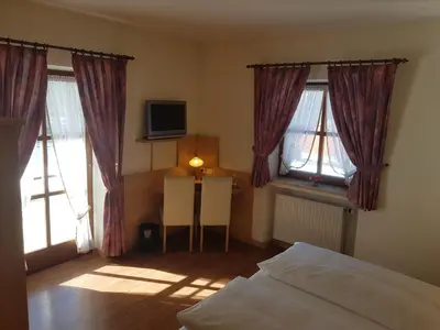 Ein Bett oder Betten in einem Zimmer der Unterkunft La Locanda Ristorante Pizzeria Garni