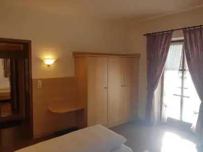 Ein Bett oder Betten in einem Zimmer der Unterkunft La Locanda Ristorante Pizzeria Garni