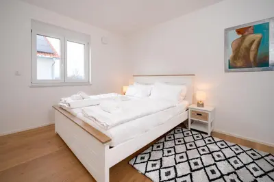 Ein Bett oder Betten in einem Zimmer der Unterkunft LIBORIA: Stylisches Haus; Sauna ; 4min zum See
