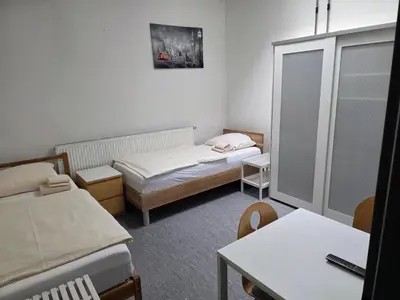 Ein Bett oder Betten in einem Zimmer der Unterkunft Pension Messe