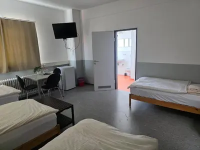 Ein Bett oder Betten in einem Zimmer der Unterkunft Pension Messe
