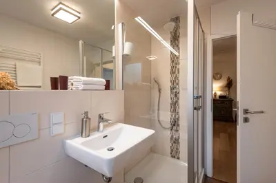 Ein Badezimmer in der Unterkunft Ferienwohnung Brünnstein - Alpenmagie Suites
