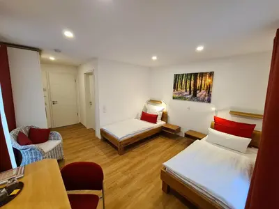 Ein Bett oder Betten in einem Zimmer der Unterkunft Apartment Gästehaus Staudenschloß