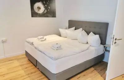 Ein Bett oder Betten in einem Zimmer der Unterkunft City Lofts Tegernsee - Moderne Studios zentral gelegen