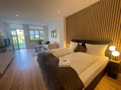 Ein Bett oder Betten in einem Zimmer der Unterkunft City Lofts Tegernsee - Moderne Studios zentral gelegen