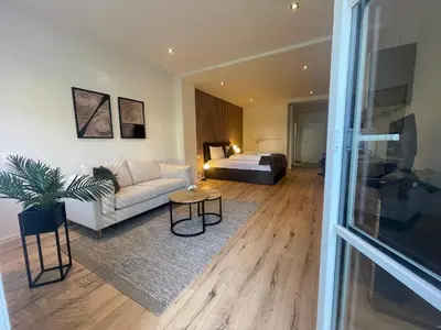 Ein Bett oder Betten in einem Zimmer der Unterkunft City Lofts Tegernsee - Moderne Studios zentral gelegen