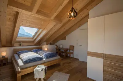 Ein Bett oder Betten in einem Zimmer der Unterkunft Alpentraum