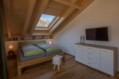 Ein Bett oder Betten in einem Zimmer der Unterkunft Alpentraum