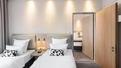 Ein Bett oder Betten in einem Zimmer der Unterkunft Holiday Inn Express - MUNICH NORTH by IHG