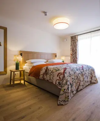 Ein Bett oder Betten in einem Zimmer der Unterkunft Bachmair Weissach See-Apartments