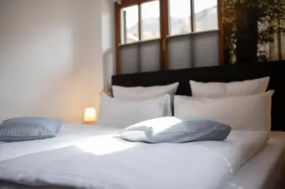 Ein Bett oder Betten in einem Zimmer der Unterkunft Jubigrat
