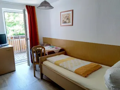 Ein Bett oder Betten in einem Zimmer der Unterkunft Pension Schneider, Bad Gögging