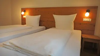 Ein Bett oder Betten in einem Zimmer der Unterkunft Hotel Heimfeld Restaurant Cafe
