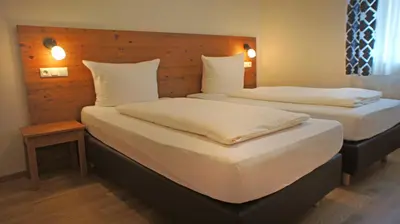 Ein Bett oder Betten in einem Zimmer der Unterkunft Hotel Heimfeld Restaurant Cafe