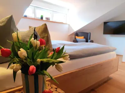 Ein Bett oder Betten in einem Zimmer der Unterkunft Ferienhaus Berger mit eigenen Whirlpool im Garten