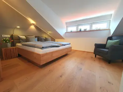 Ein Bett oder Betten in einem Zimmer der Unterkunft Ferienhaus Berger mit eigenen Whirlpool im Garten