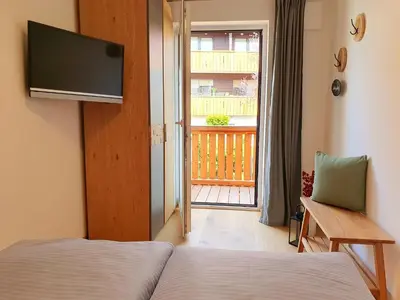 Ein Bett oder Betten in einem Zimmer der Unterkunft Ferienhaus Berger mit eigenen Whirlpool im Garten