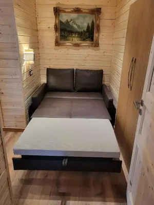 Ein Bett oder Betten in einem Zimmer der Unterkunft Golden GaPa Central Chalet Apartment 32