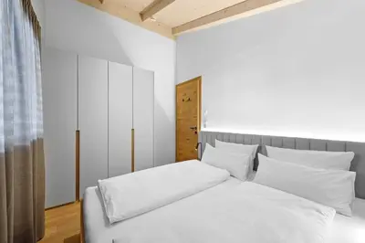 Ein Bett oder Betten in einem Zimmer der Unterkunft Riverside Chalet Alpspitze