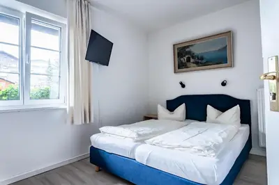 Ein Bett oder Betten in einem Zimmer der Unterkunft Gästehaus Alpenkranz