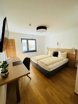 Ein Bett oder Betten in einem Zimmer der Unterkunft Creo München Süd