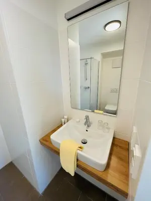 Ein Badezimmer in der Unterkunft Creo München Süd