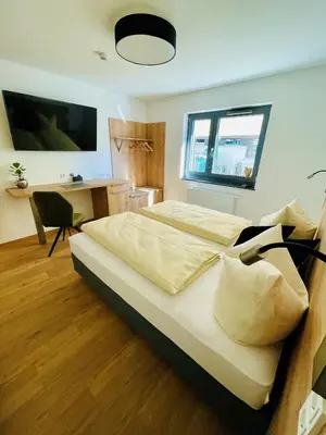 Ein Bett oder Betten in einem Zimmer der Unterkunft Creo München Süd