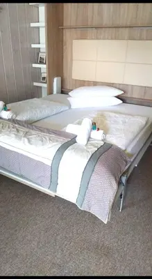 Ein Bett oder Betten in einem Zimmer der Unterkunft Ferienwohnung Kirchbichl am Schliersee mit Terrasse