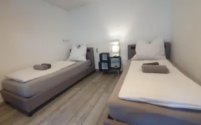 Ein Bett oder Betten in einem Zimmer der Unterkunft Neuburg Center Appartments